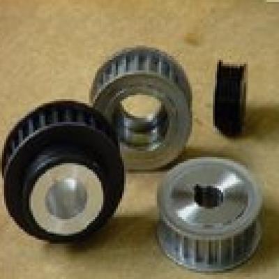 What are the characteristics of the timing belt in the transmission?